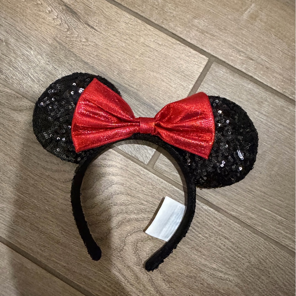 Disney Parks Minnie Mouse ears headband featuring black sequins red shimmer bow